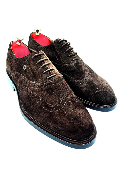 Brown suede dress shoes with red lining on a white background