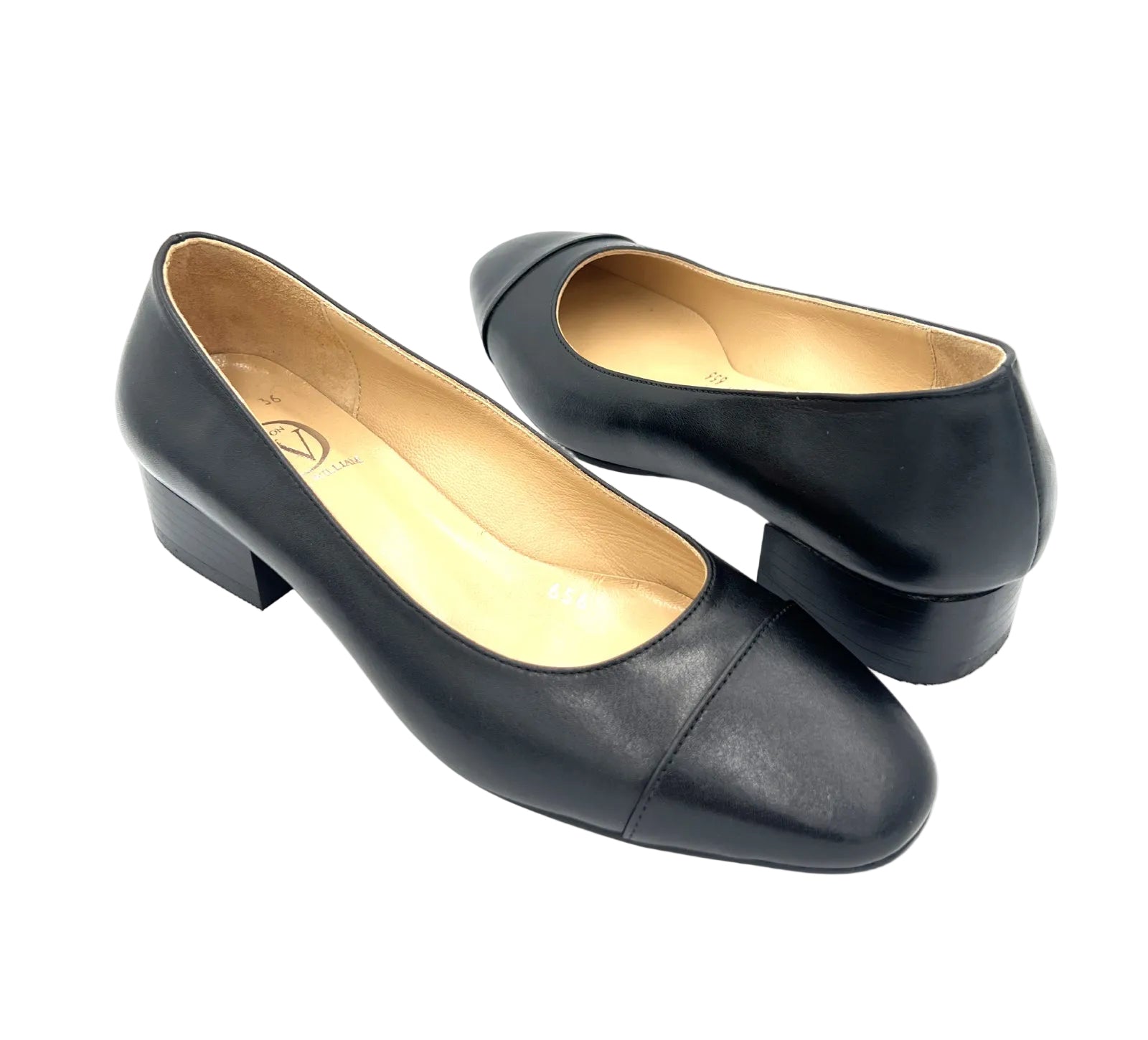 Pair of black shoes on a white background